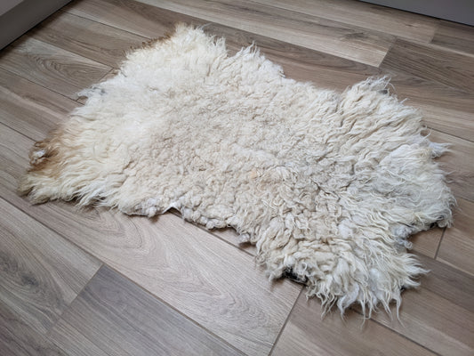 Medium cream rustic rug
